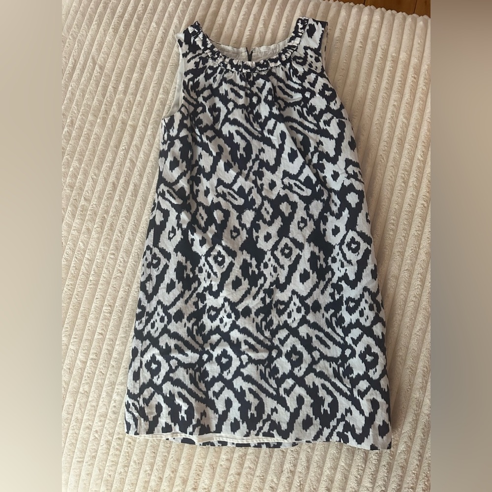 Cute sundress by the loft. Worn once! Navy in color, true white.